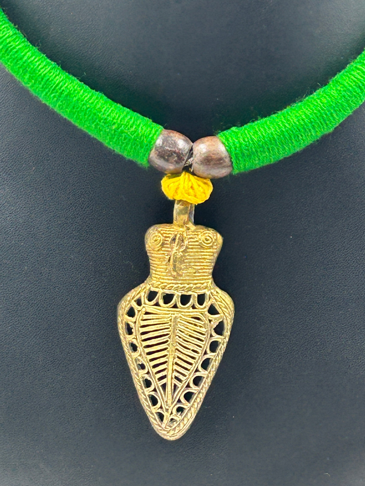 Close-up of Handcrafted Dokra Owl Pendant on Green Thread Choker Necklace